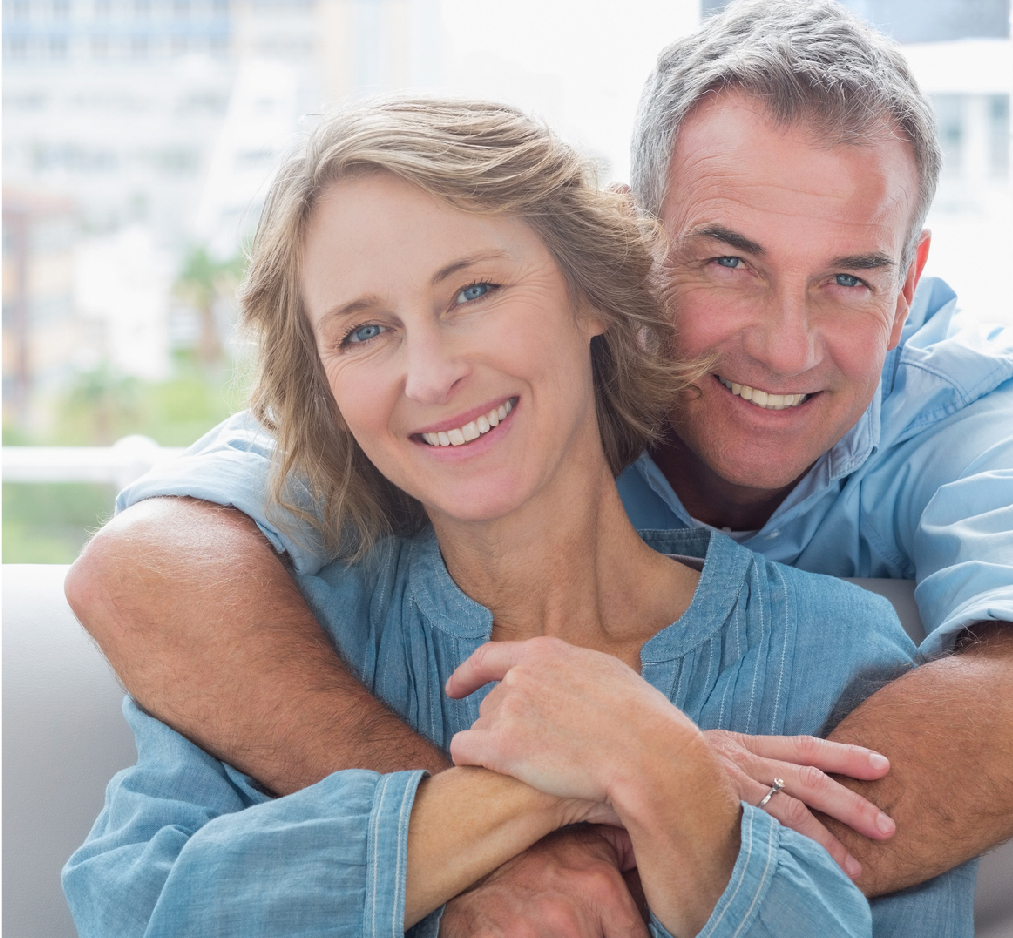 A happy couple hugging and smiling at Cory Roletto, DDS 